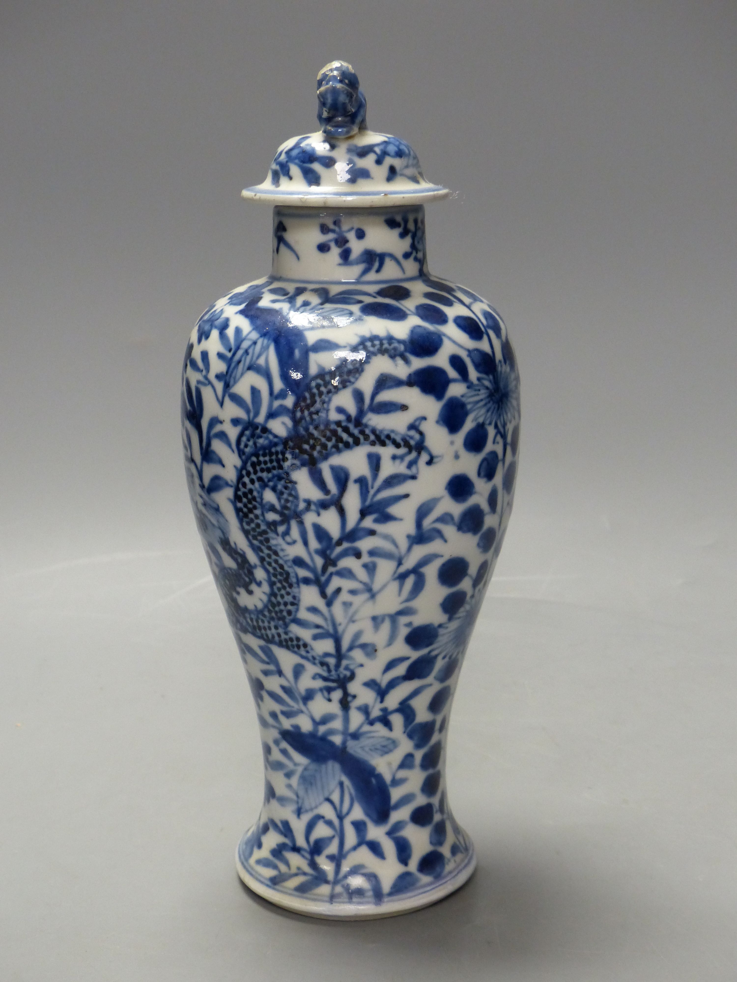 A 19th century Chinese blue and white dragon vase and cover, height 27cm